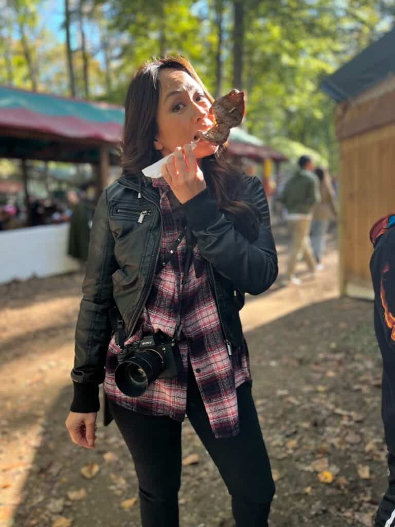 Amy eating turkey drumstick at Renn Fest